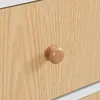 A close-up of a wooden drawer knob on a light wood grain surface. Produktbild-Vorschau