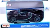 A black Maisto 1:24 scale Bugatti Chiron model car in its original packaging. Voir les images du produit