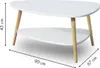A white two-tiered coffee table with wooden legs, shown with dimensions indicated by measurement lines and text. Náhled obrázku produktu