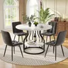 A dining set with a round marble-top table and four upholstered chairs in a well-lit room with large windows and a wooden cabinet. Produktbild-Vorschau