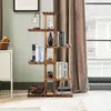 A wooden plant stand with books and decorative items, placed near a window with curtains. Produktbild-Vorschau