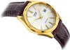 A close-up shot of a gold-colored Casio watch with a white face and a brown leather strap, set against a white background. Anteprima dell’immagine prodotto