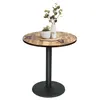 A round table with a wood-grain top and a black pedestal base, decorated with a small plant and a candle. Produktbild-Vorschau