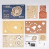 The image displays the packaging and components of a ROKR 3D-Puzzle 'Zodiac Wall Clock'. It includes the product box, unassembled wooden puzzle sheets, and assembly instructions. Voir les images du produit