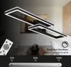 A modern, rectangular LED ceiling light fixture with a remote control and dimming indicator. Produktbild-Vorschau