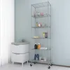 A bathroom or laundry room setting with a sink cabinet and a metal shelving unit. Voir les images du produit