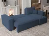 A blue sectional sofa is shown in a living room setting, with a fireplace in the background. Produktbild-Vorschau