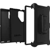 A disassembled black OtterBox Defender case for a Samsung Galaxy S24 Ultra, showing the inner protective layer, the outer frame, and the holster. Podgląd zdjęcia produktu