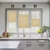 A kitchen sink area with a window above it, featuring beige pleated blinds. Produktbild-Vorschau