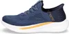 A side view of a blue Skechers slip-on sneaker with a white sole and gold accents. Voir les images du produit