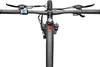 A close-up, top-down view of an electric mountain bike's handlebars and front fork. Produktbild-Vorschau