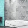 A shower screen installed over a bathtub in a bathroom with tiled walls. Produktbild-Vorschau