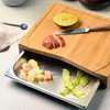 A bamboo cutting board with a built-in stainless steel drawer for food scraps. Anteprima dell’immagine prodotto