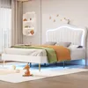 A child's bedroom with a white bed, decorated with toys and bedding. Anteprima dell’immagine prodotto