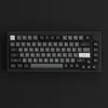 A top-down view of a black mechanical keyboard on a black background. Produktbild-Vorschau