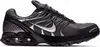 A side view of a black and gray Nike Air Max Torch 4 sneaker against a white background. Voir les images du produit