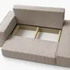 A close-up view of the interior storage compartment of a beige sofa. Náhled obrázku produktu