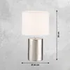 A table lamp with a textured silver base and a white cylindrical shade, shown against a gray textured background. Dimensions are indicated with dashed lines and text. Produktbild-Vorschau
