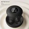 A pair of black wireless earbuds in their charging case, with a digital display showing battery percentage. Produktbild-Vorschau