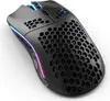 A black gaming mouse with honeycomb cutouts and RGB lighting. Podgląd zdjęcia produktu