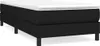 A black boxspring bed frame with a white mattress topper, shown from a side angle on a white background. Produktbild-Vorschau