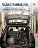 A folded electric bicycle is placed in the trunk of a car, with text overlay describing its folding frame design. Produktbild-Vorschau