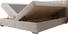 A beige upholstered bed frame with its mattress lifted to reveal storage space underneath. Voir les images du produit