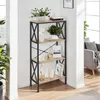 A shelf unit with decorative items and plants in a room setting. Voir les images du produit