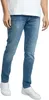 A person wearing blue jeans and white sneakers, shown from the waist down against a white background. Produktbild-Vorschau