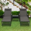 Two lounge chairs and a small table are set up on a grassy lawn in front of a white staircase and lush green plants. Náhľad obrázku produktu
