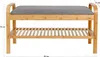 A product shot of a bamboo shoe rack with a gray seat cushion. Produktbild-Vorschau