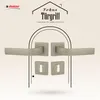 A marketing image showcasing a set of door handles and rosettes against a decorative background. Produktbild-Vorschau