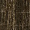 A close-up view of a privacy screen made of natural materials, possibly heather or similar vegetation, held together by wire. Produktbild-Vorschau