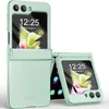 A mint green flip phone case is shown in an open and closed position against a white background. Produktbild-Vorschau