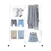 A white, multi-tiered drying rack with various clothing items and towels displayed on it. Produktbild-Vorschau