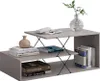 A modern, multi-tiered coffee table with books and a vase. Voir les images du produit