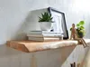 A wooden shelf with decorative items, including books, plants, and a wooden mannequin. Náhled obrázku produktu