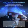 A child sleeping in bed with a star projector casting a starry sky on the ceiling. Produktbild-Vorschau