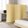 A room divider is placed between a workspace and a bedroom area. Náhled obrázku produktu