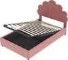 A pink upholstered bed frame with the mattress support mechanism lifted to reveal storage space underneath. Podgląd zdjęcia produktu