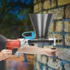 A person is holding a mortar gun against a brick wall. Podgląd zdjęcia produktu