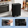A black dual-compartment kitchen trash can is shown next to a stove, with close-up insets highlighting its side handles and anti-slip footpads. Náhled obrázku produktu