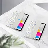 Two tablet cases with a floral pattern are displayed on a marble surface. Anteprima dell’immagine prodotto
