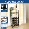 A wine rack filled with wine bottles and glasses, with decorative plants and a bottle of wine on top. The image is set against a light-colored background with curtains. Produktbild-Vorschau