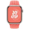 A close-up front view of an Apple Watch with a coral-colored Nike Sport band and a coral-colored watch face displaying the time. Podgląd zdjęcia produktu