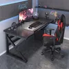 A gaming desk setup with a computer, chair, and accessories. Náhled obrázku produktu