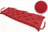A red tufted bench cushion on a white background. Produktbild-Vorschau