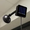 A close-up of a solar-powered light with a suction cup mount. Náhled obrázku produktu