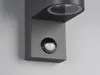 A close-up shot of a modern gray wall-mounted light fixture with a motion sensor. Produktbild-Vorschau