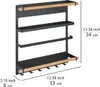 A black metal kitchen shelf with wooden accents, featuring multiple shelves and hooks, with dimensions indicated by text overlays. Voir les images du produit